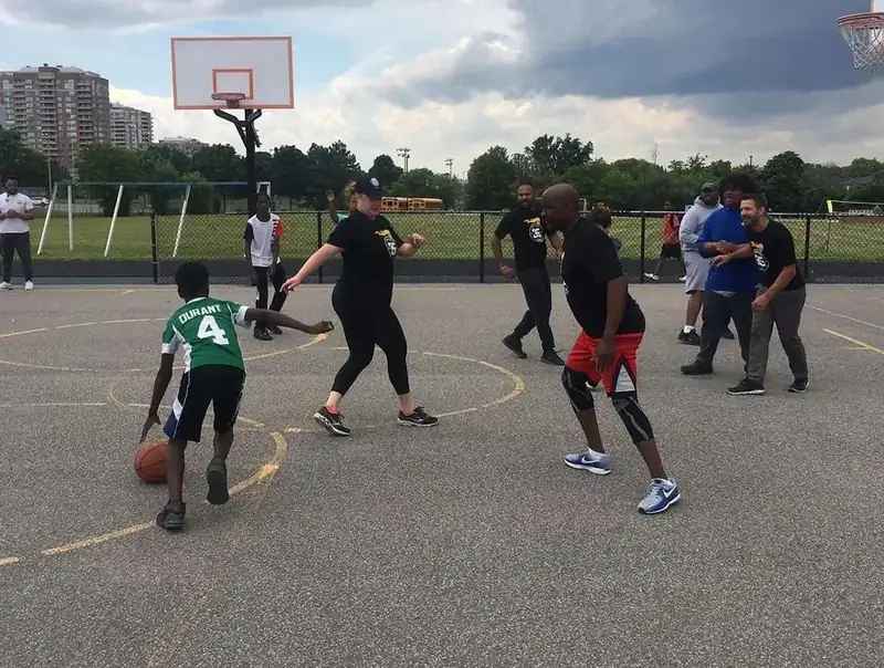 Youth and officers playing sports at the Toronto Sports Festival